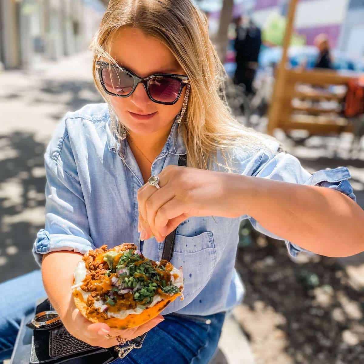 A person holding a Taco