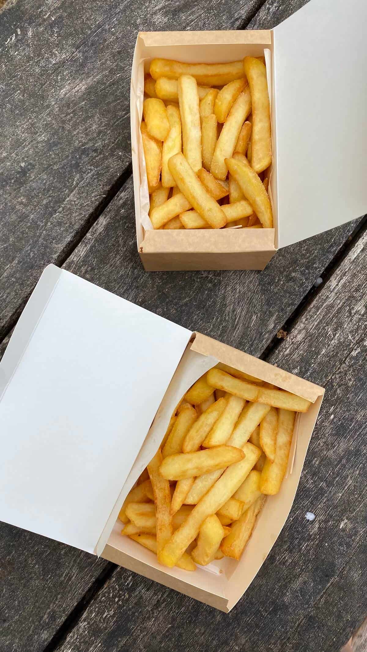 A carton of fries on a table