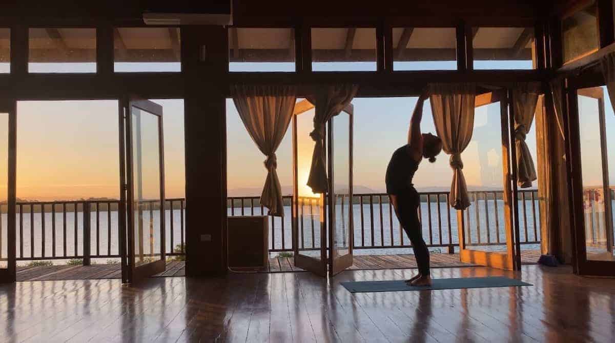 A woman doing yoga in a room. 