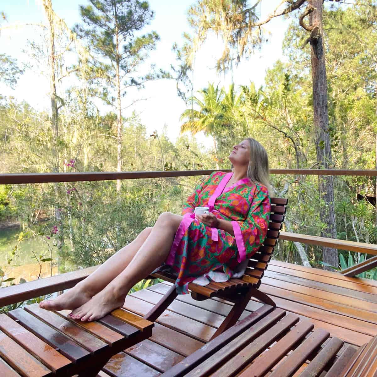 A woman sitting on a wooden bench