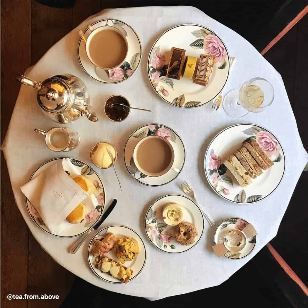 An overhead shot of afternoon tea items on a table. 