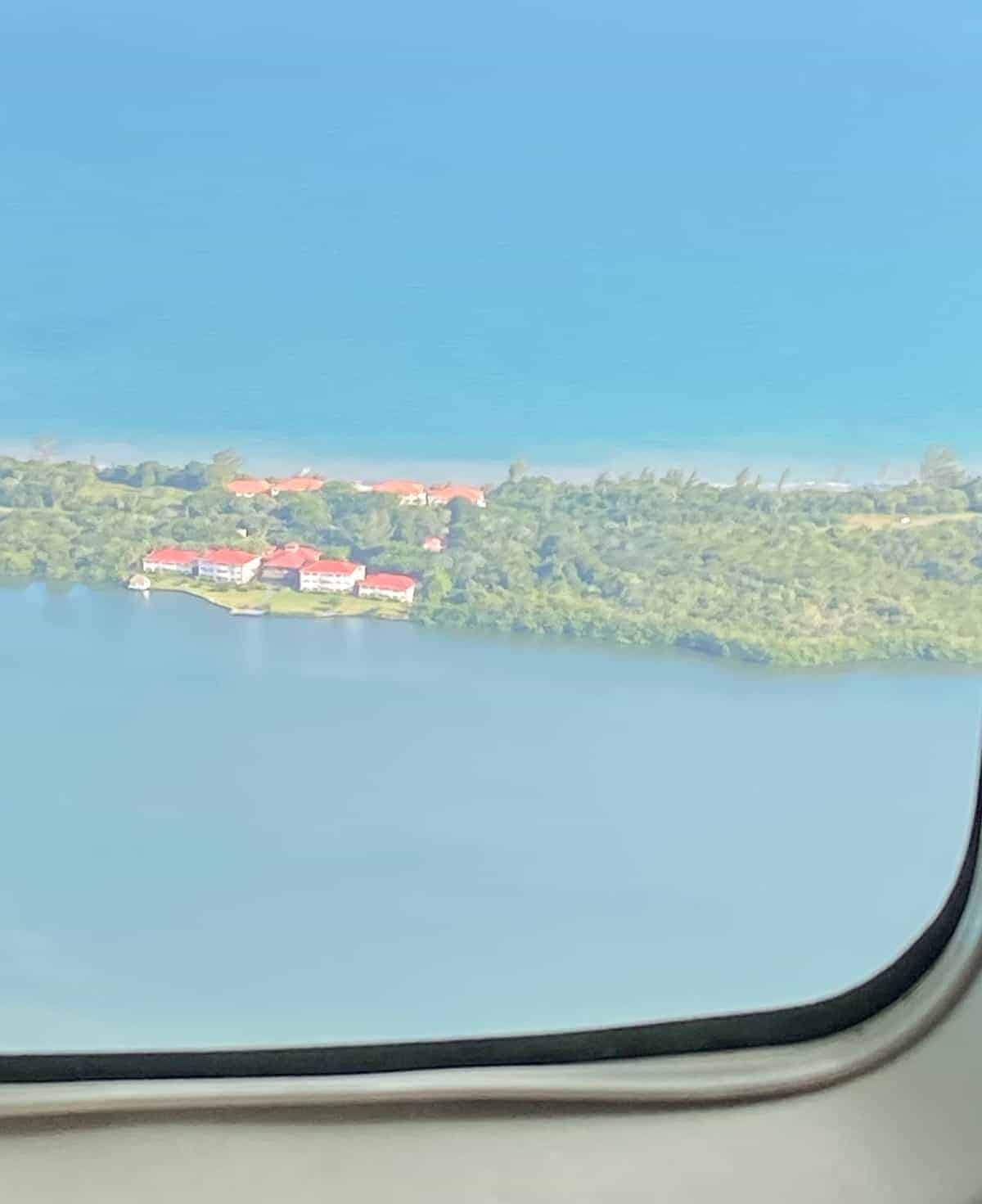 A view of a body of water from a plane window. 