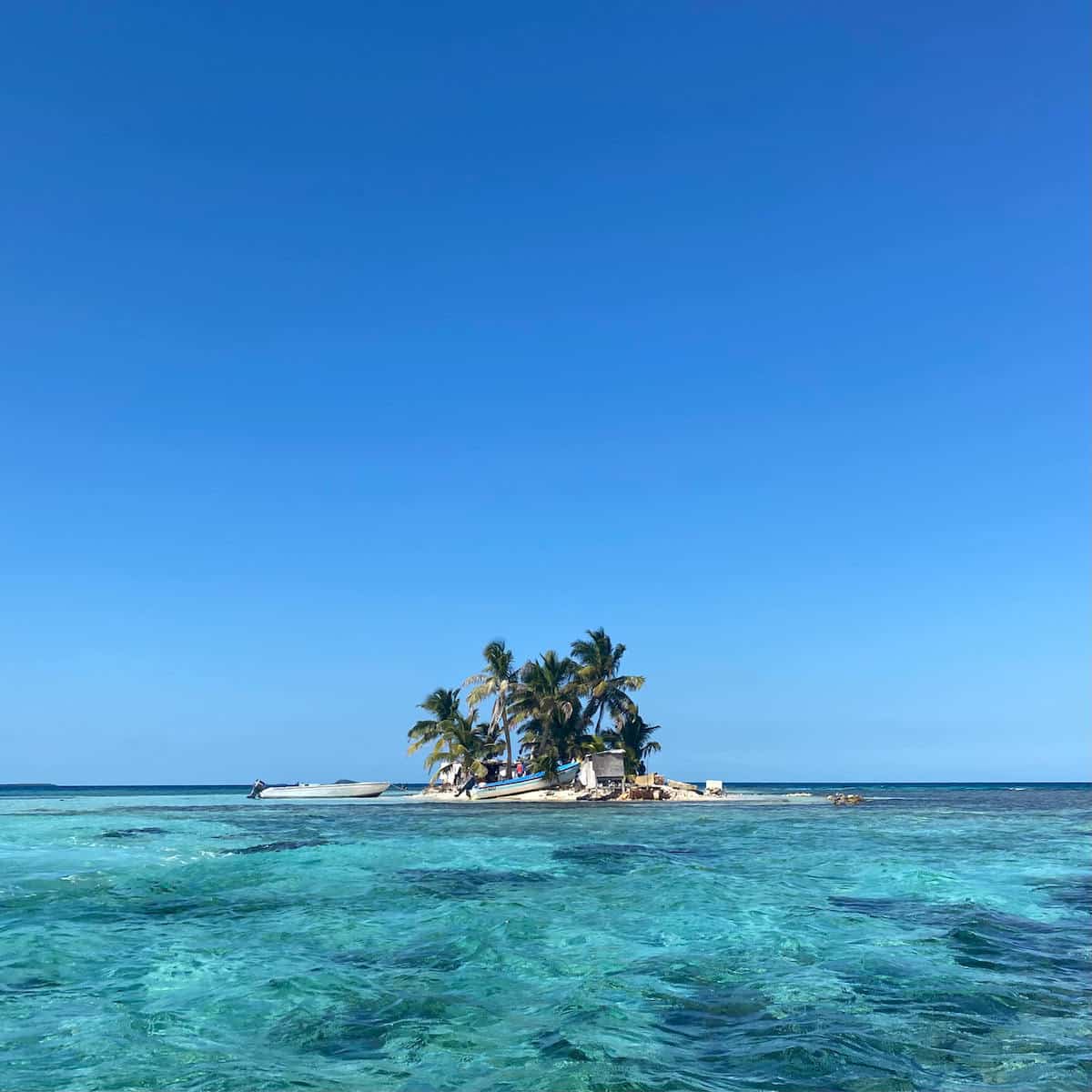 A large body of water and a small island. 