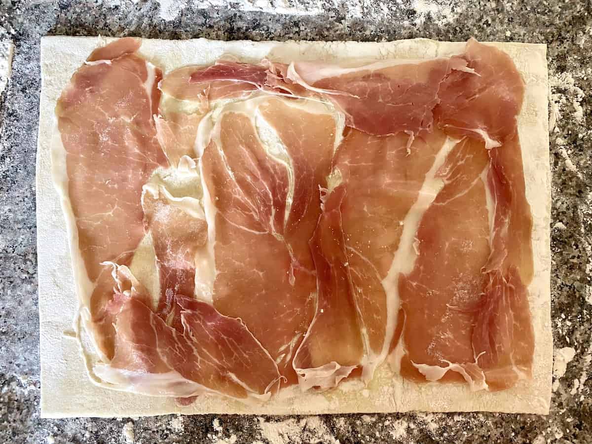 Lay prosciutto onto the puff pastry