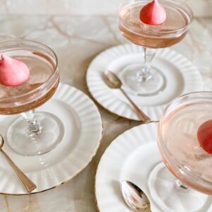 Pink prosecco jelly served in champagne coup glasses.