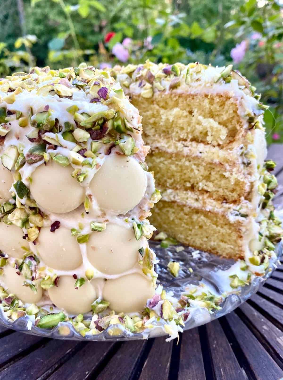 a slice of white chocolate and pistachio cake