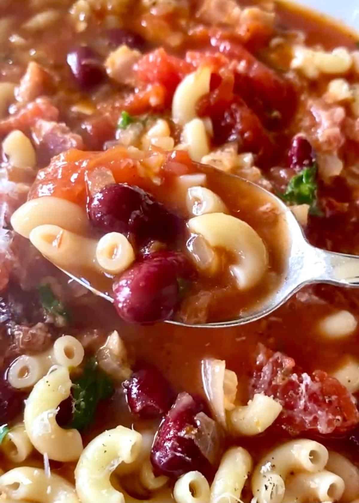 a spoonful of pasta and kidney beans soup