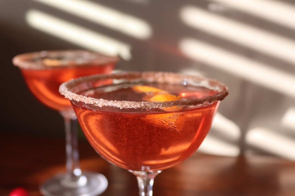 Christmas Cranberry cocktail with champagne and an orange twist 