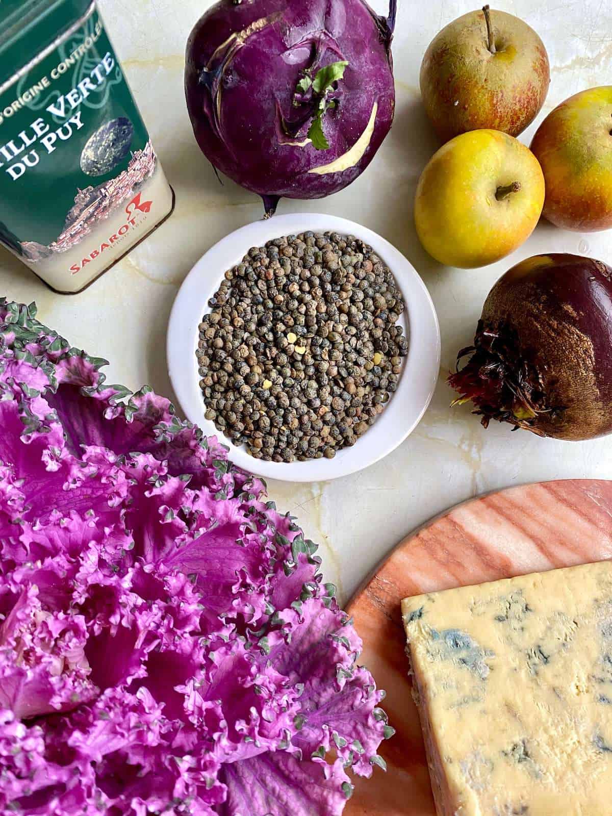 Ingredients for purple kale salad with lentils, apple, beetroot, blue cheese and kohlrabi