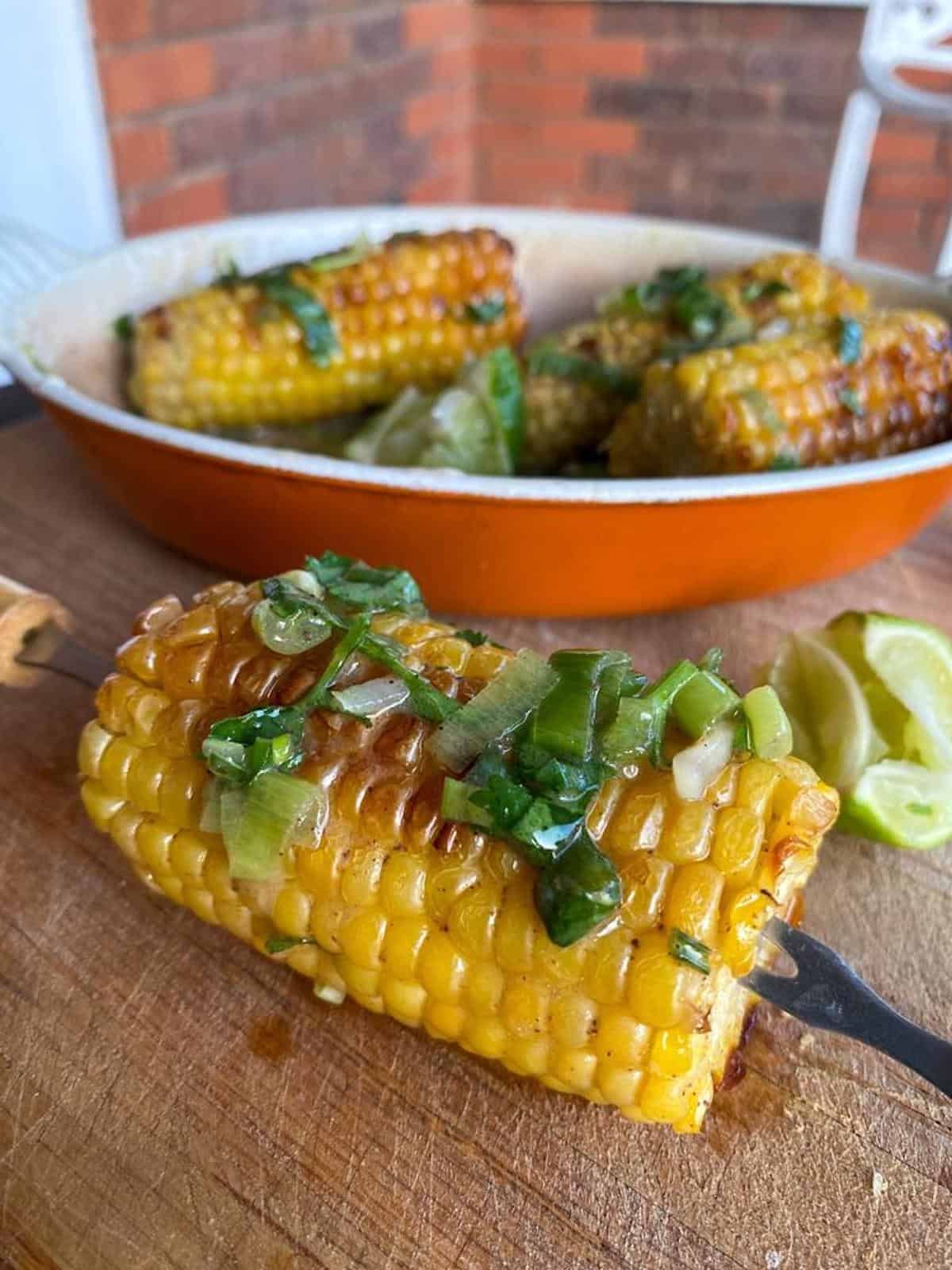 buttered sweet corn dripping in lime coriander spiced compound butter 