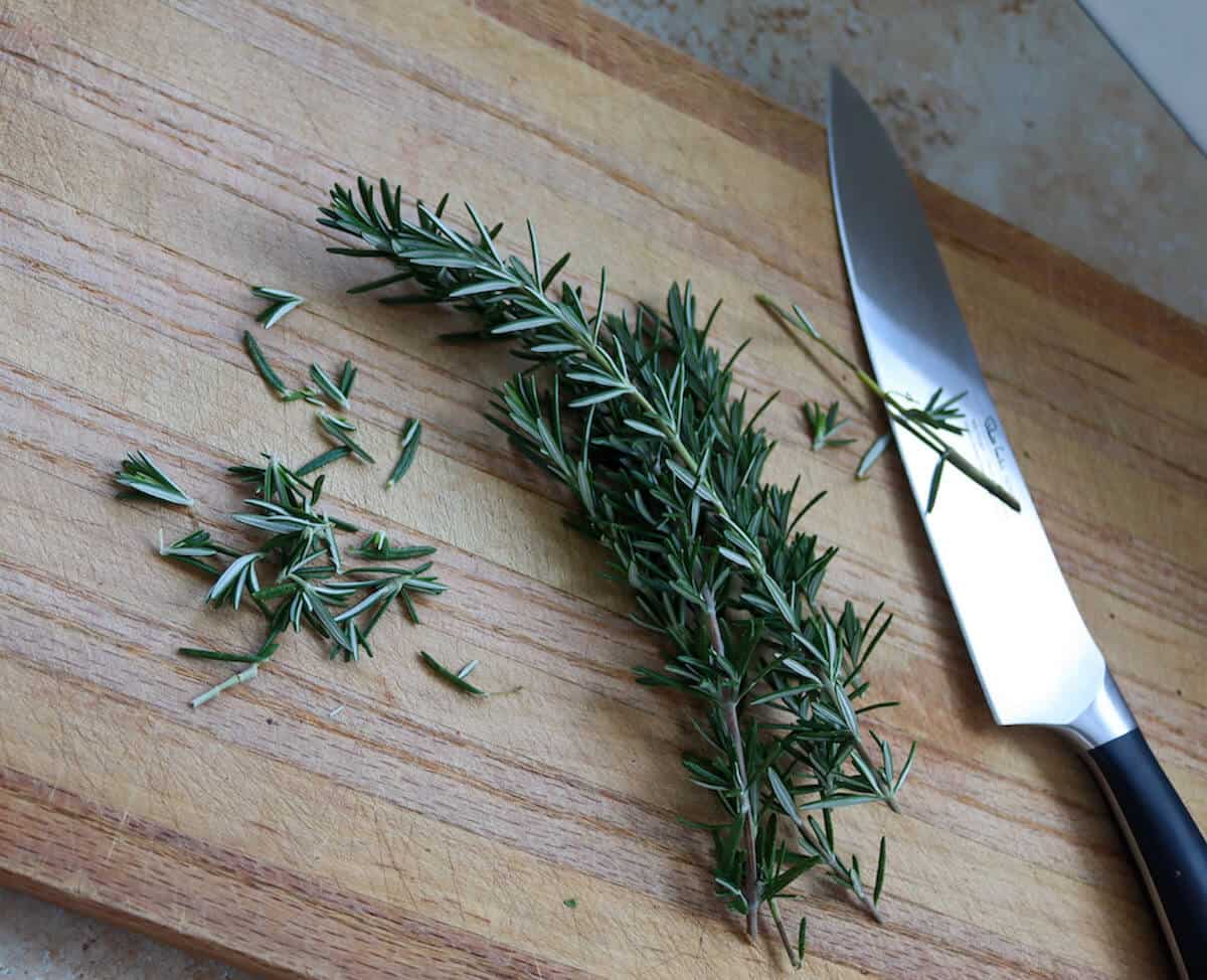 fresh rosemary on a chopping board 