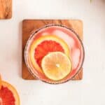 A blood orange margarita, one of the classiest cocktails there is! Garnished with fresh slices of blood orange.