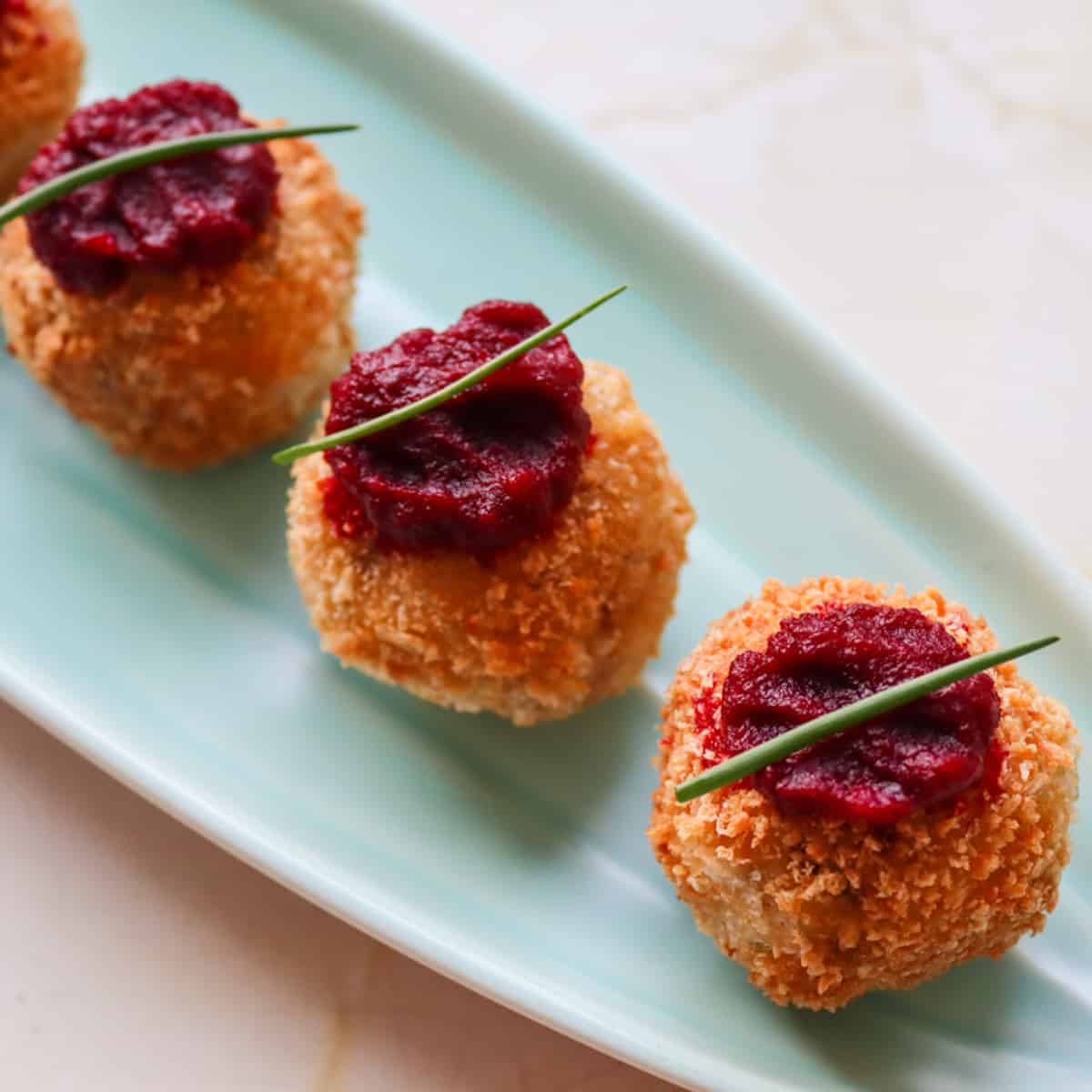Smoked mackerel croquettes with beetroot puree on a canapé tray