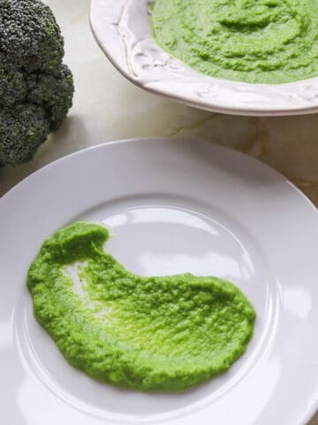 Truffle broccoli asparagus puree on a dinner plate