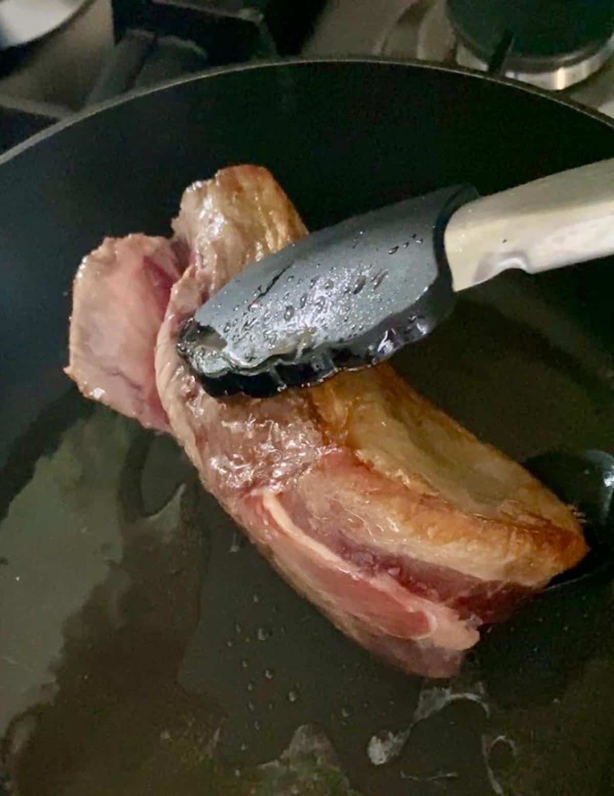 Searing lamb rump in a frying pan