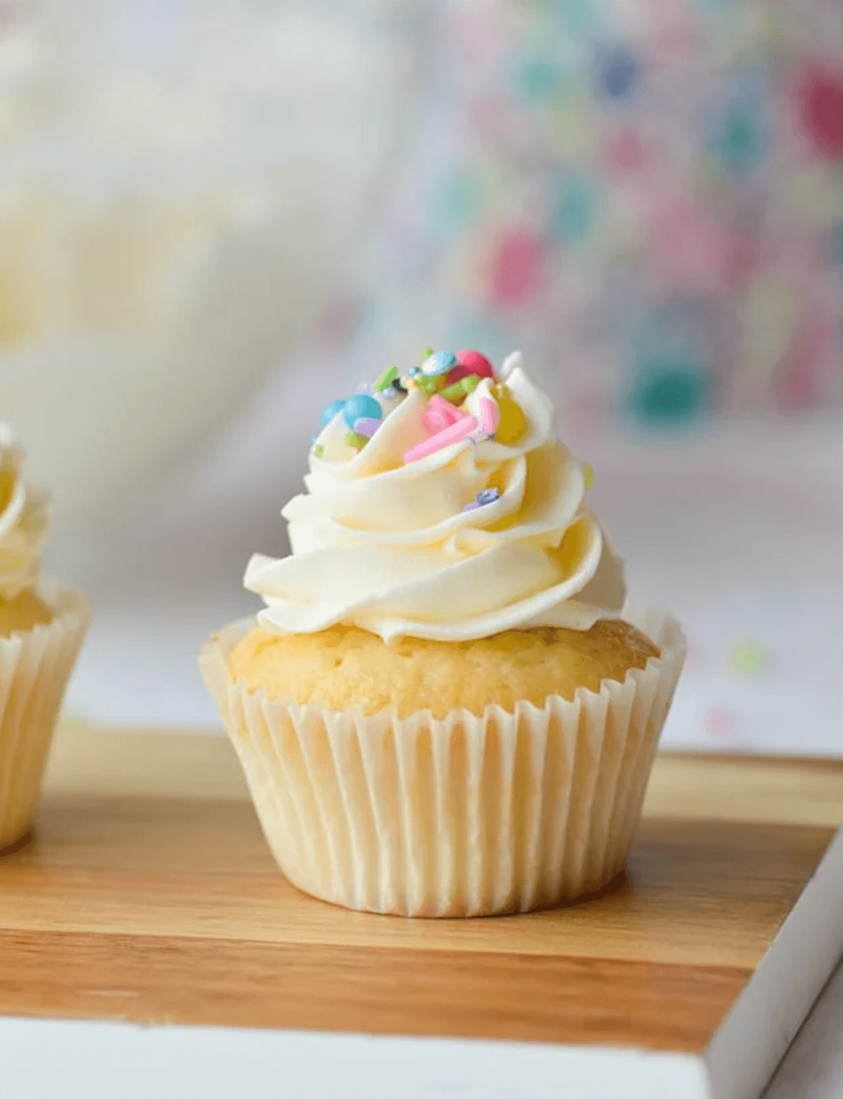 A cupcake topped with Swiss meringue buttercream made from leftover egg whites.