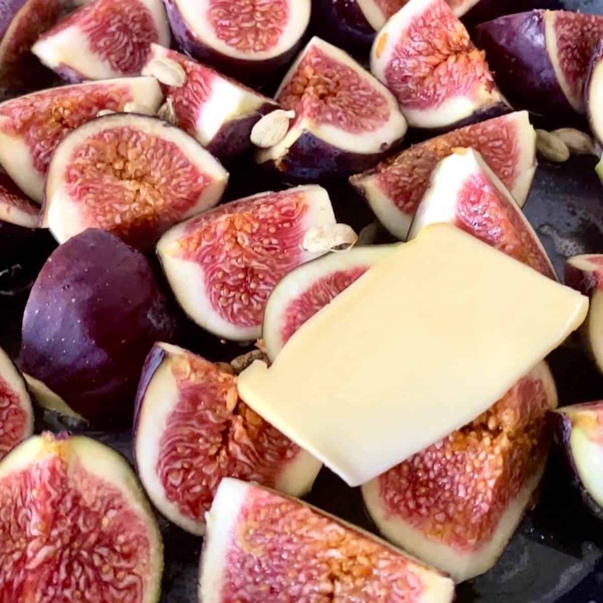 Figs and cardamom pods cooking in butter snd sugar. 