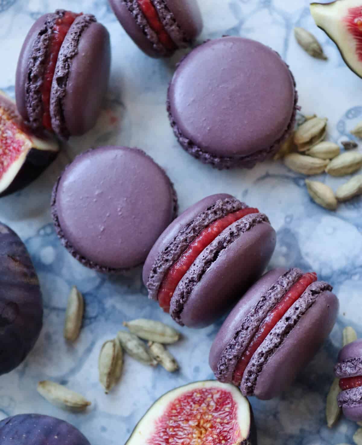 Purple fig macarons on a serving platter. 