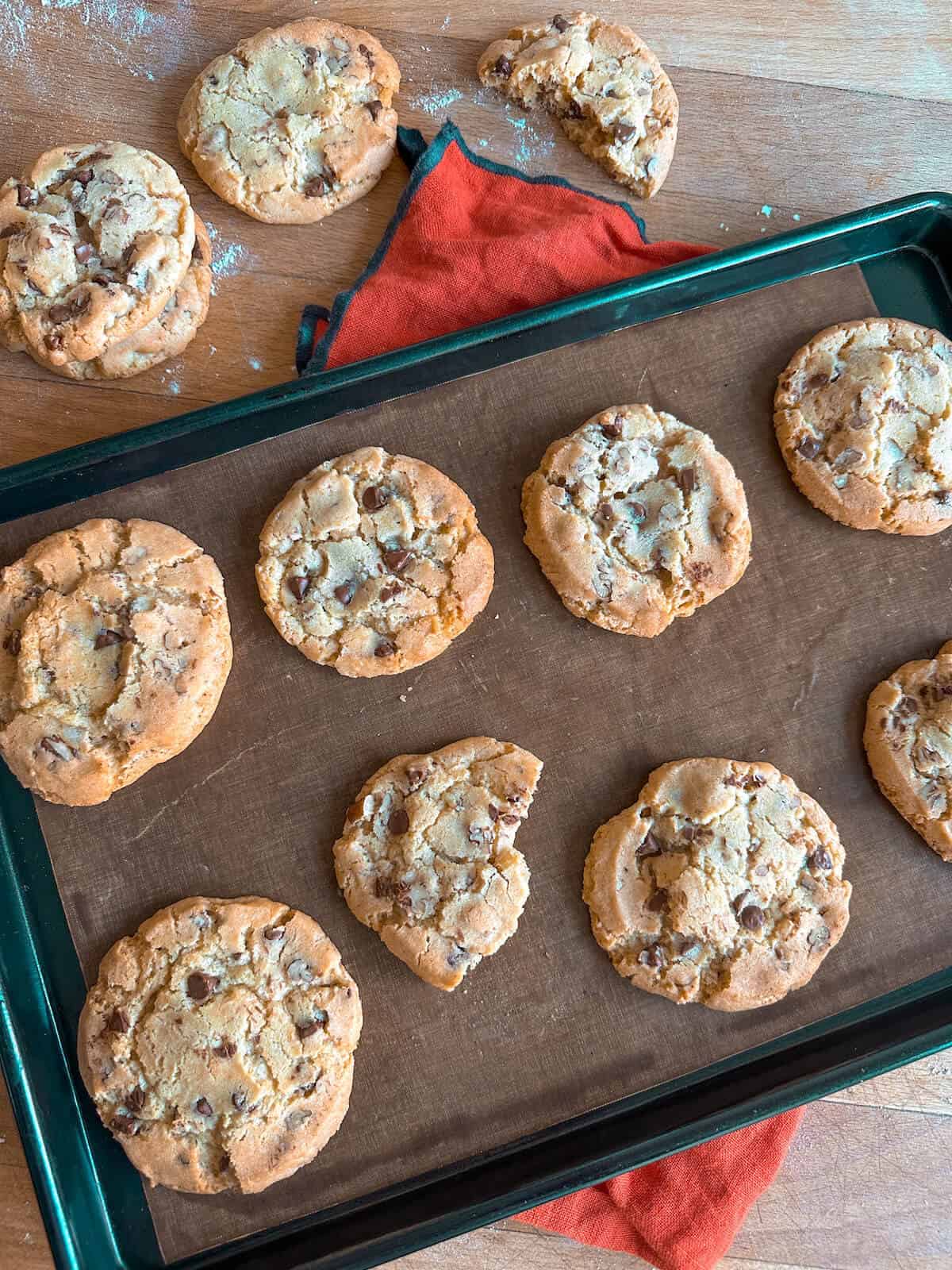 A tray of baked cookies, some of which are half eaten. 