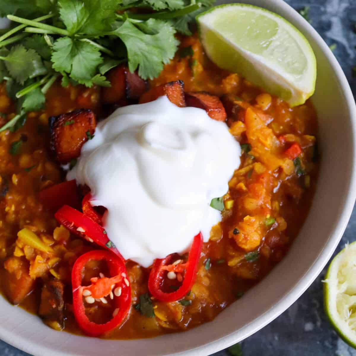 Red lentil, coconut and sweet potato dahl with a spoonful of yogurt on top. 