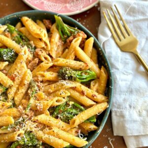 Spicy-Sausage-Broccolini-Pasta-in-a-bowl-next-to-a-fork.