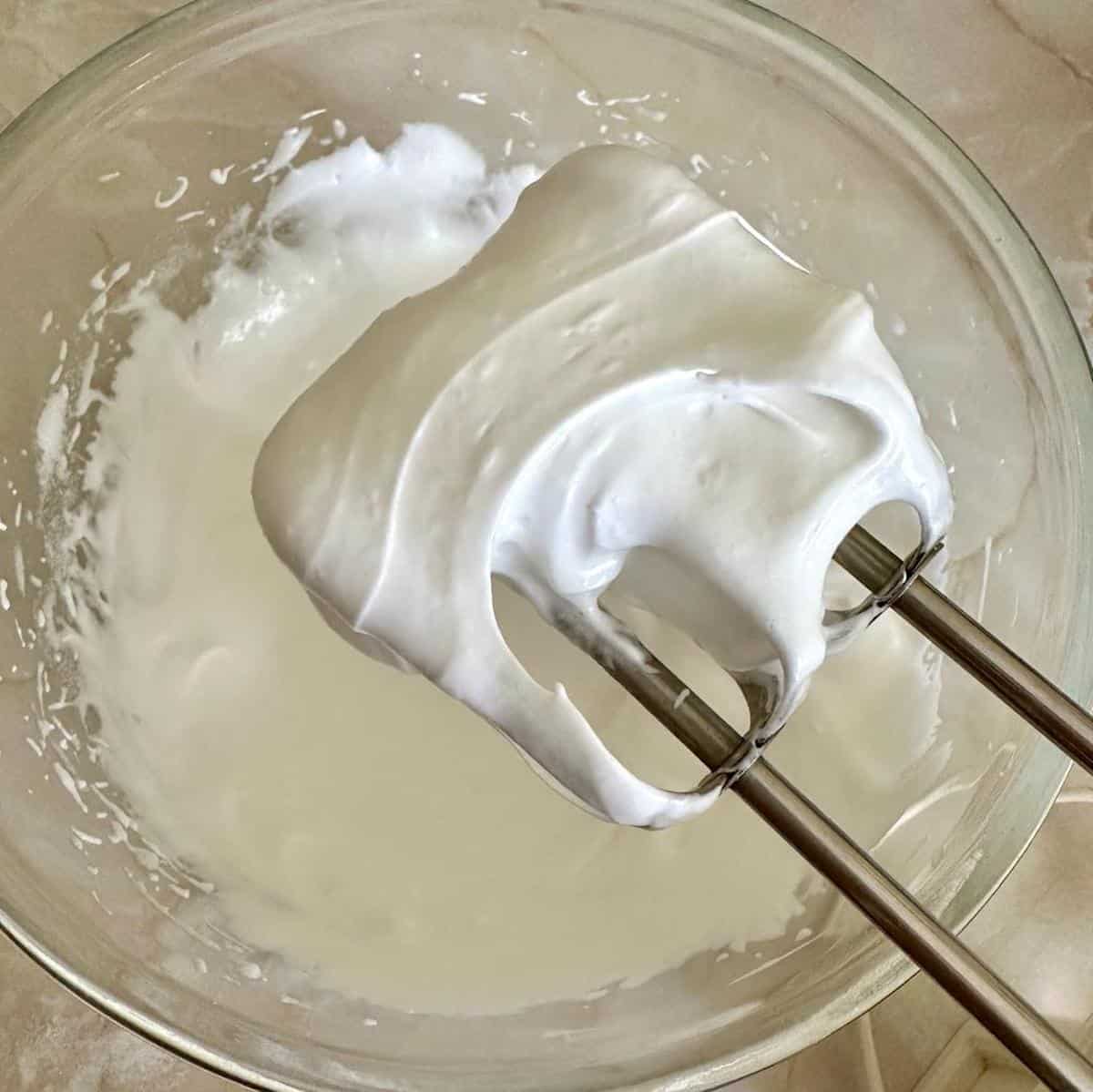 Whipped-egg-whites-and-sugar-in-a-mixing-bowl.