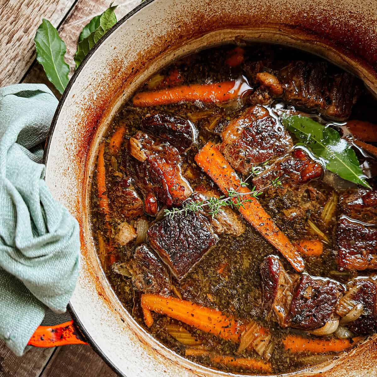 A Dutch Oven Filled With Slow Cooked Beef Short Ribs Braised In Beer. 