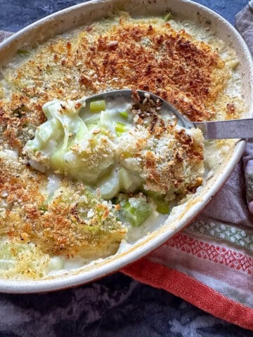 Creamy Gorgonzola Baked Leeks Au Gratin In an Oven Dish.