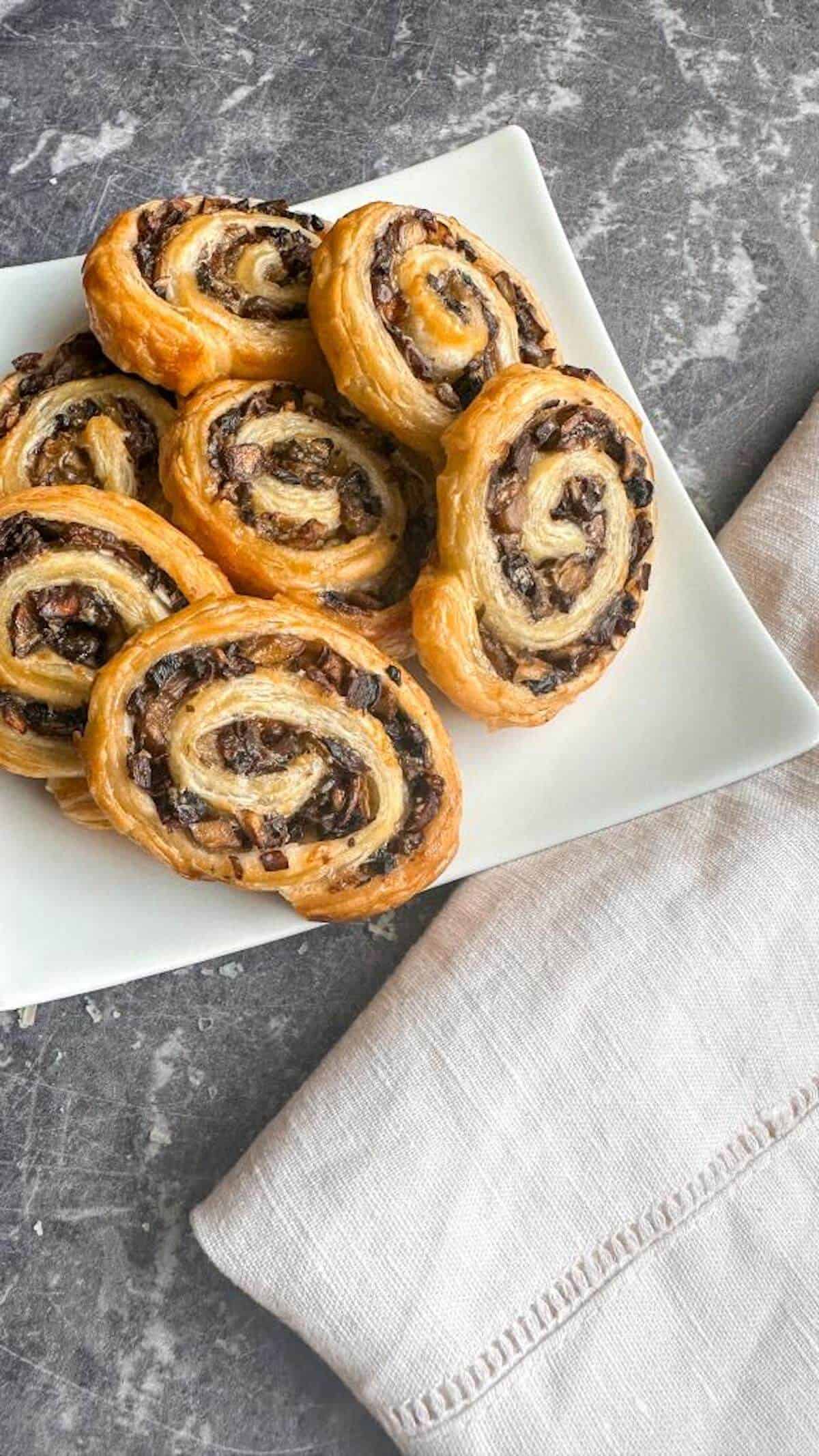 A plate of mushroom pinwheels ready to serve.  as a party appetizer