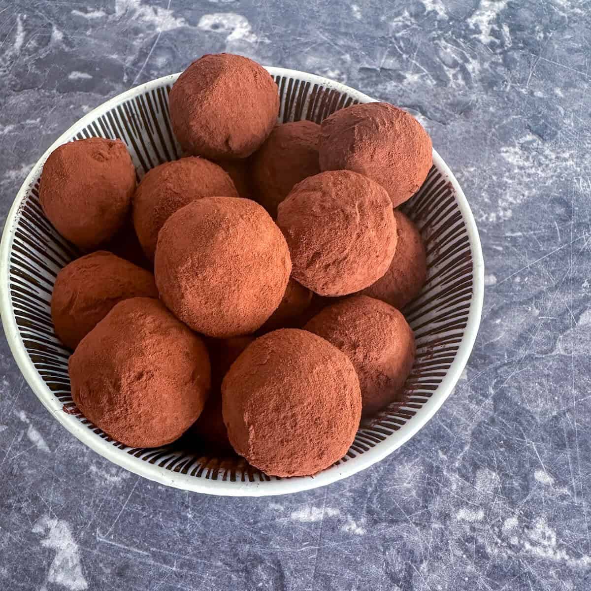 A bowl of dark chocolate boozy truffles.  