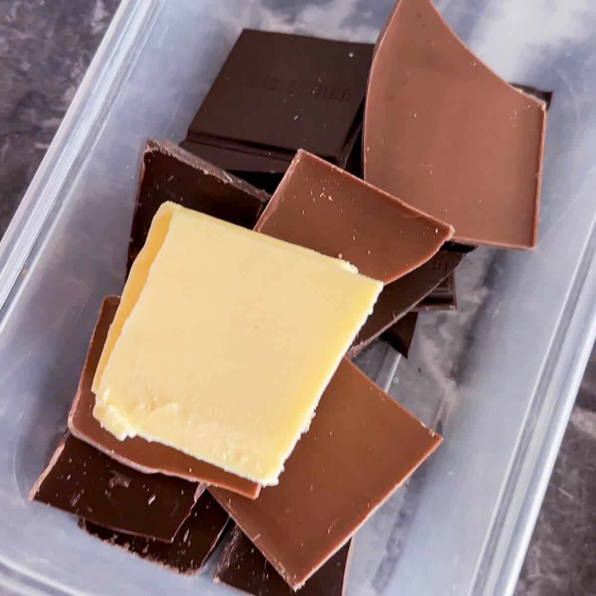 Chocolate and butter in a plastic container. 