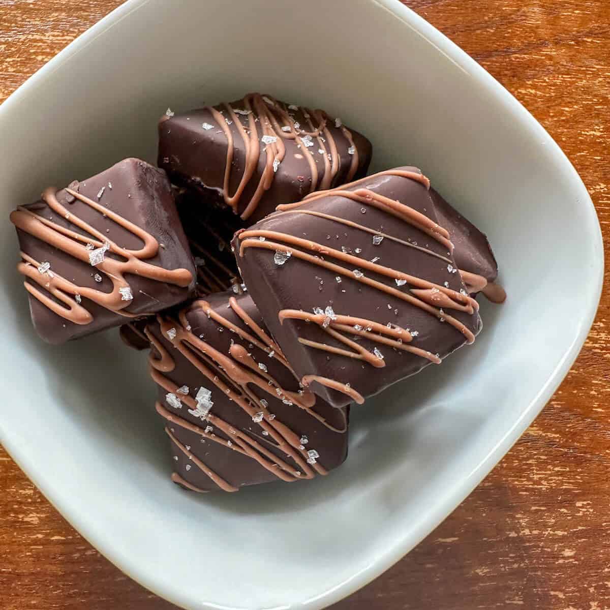 Chocolate and sea salt truffles in a serving bowl.