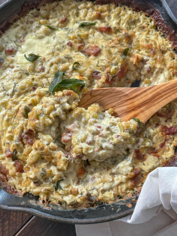 Creamy flageolet beans in a cast iron skillet.