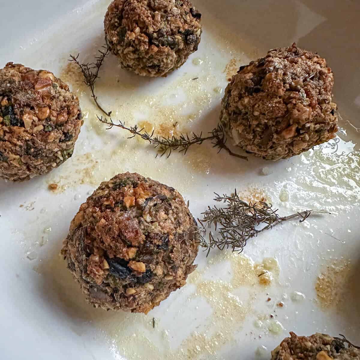 Baked stuffing balls in an oven dish. 