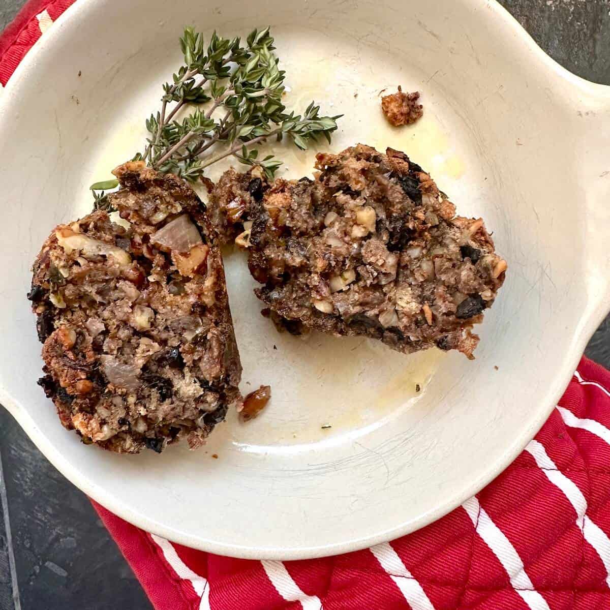A walnut and mushroom stuffing ball cut open to see the inside. 