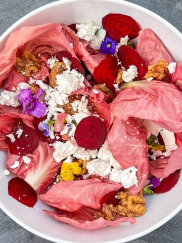 beetroot carpaccio salad with pink leaves, walnuts and goat cheese.