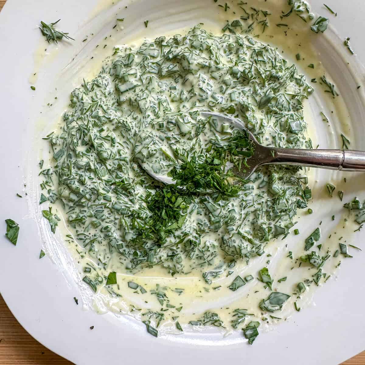 Dressing for crispy smashed potato salad in a bowl. 