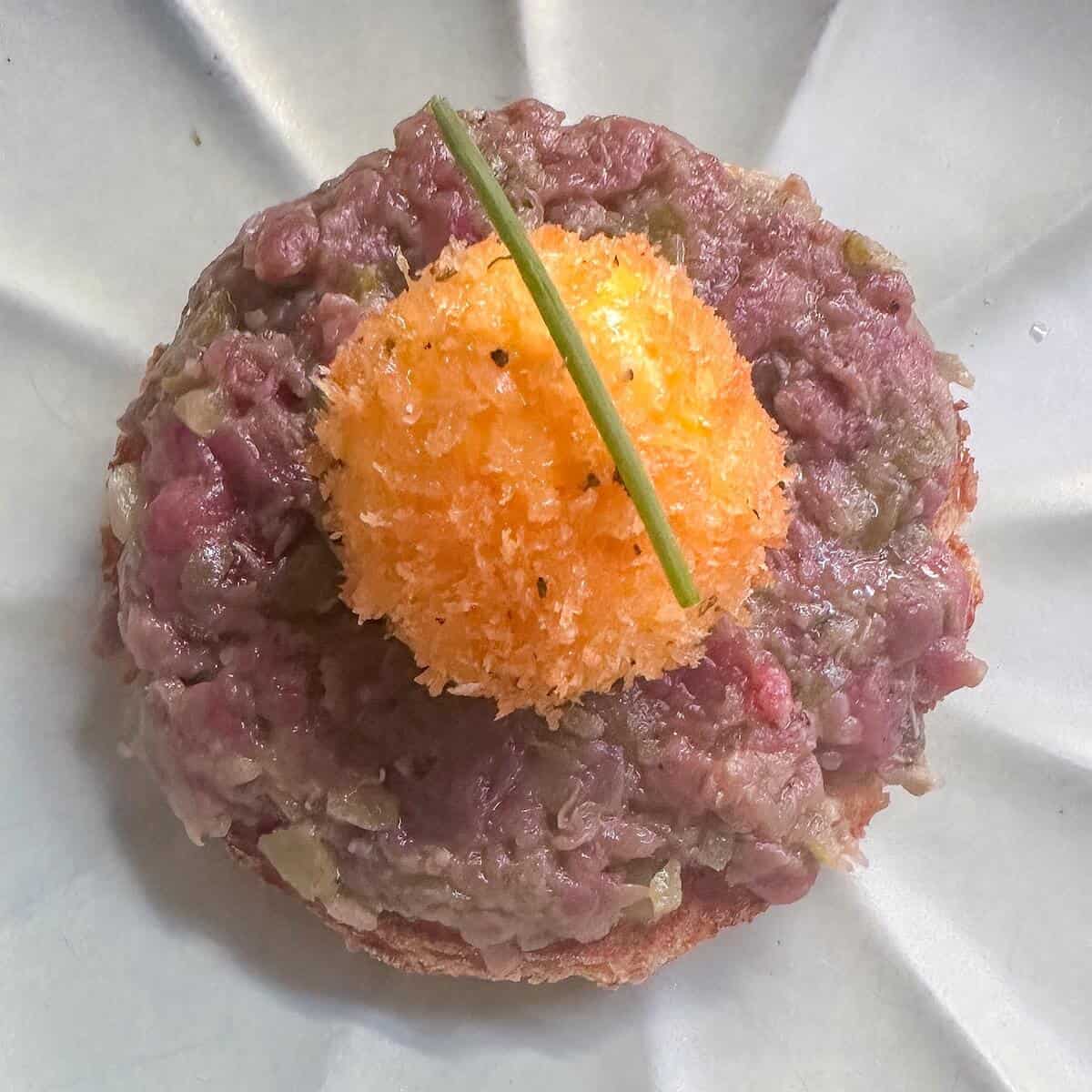 Steak tartare with a panko egg yolk.