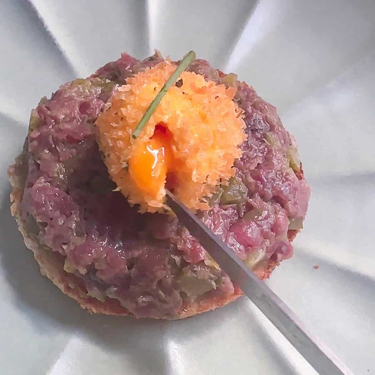 Steak Tartare with runny panko egg yolk.