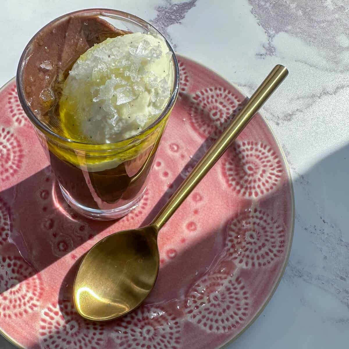 A glass of chocolate olive oil mousse and cardamom whipped cream.