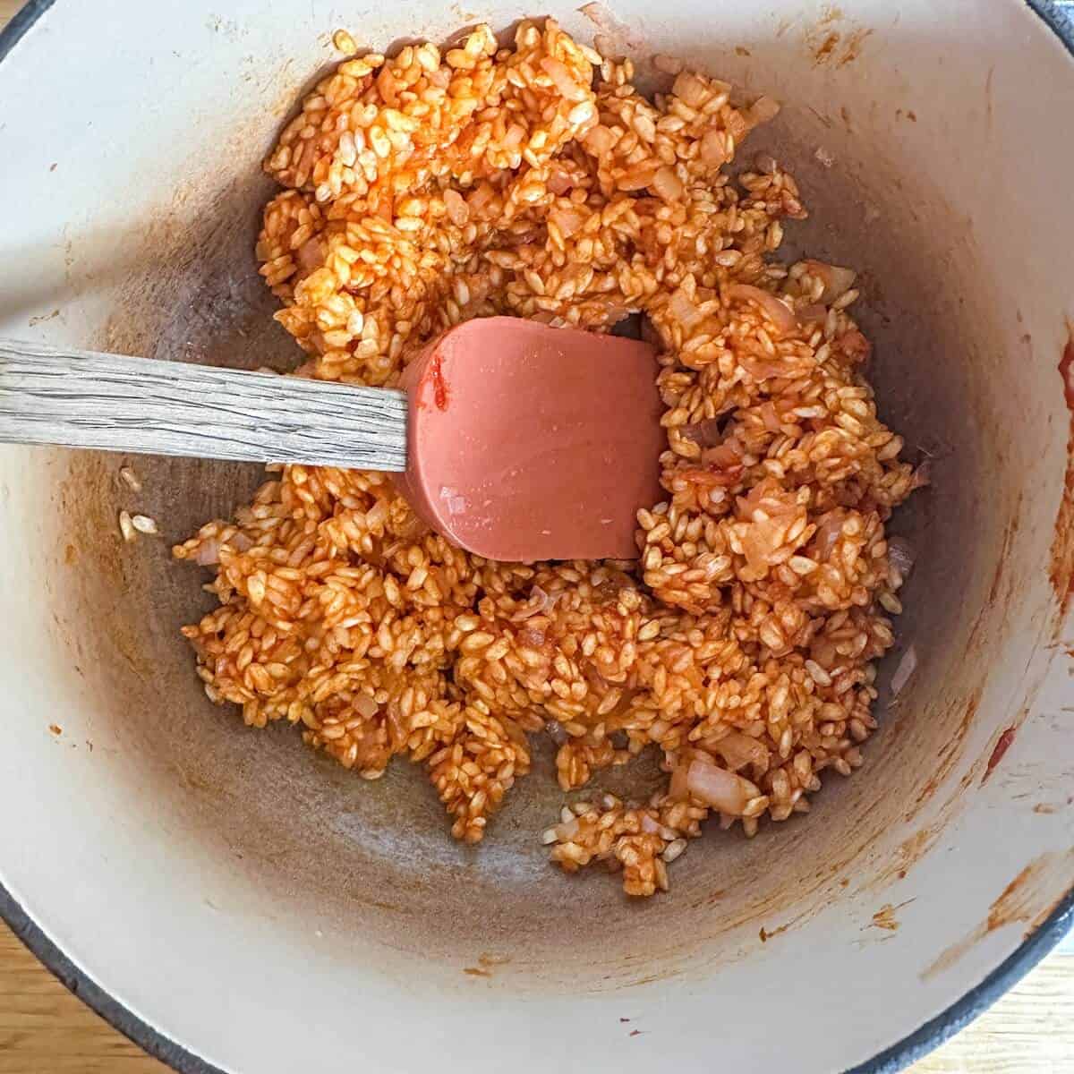A pot on the stove of gochujang risotto.