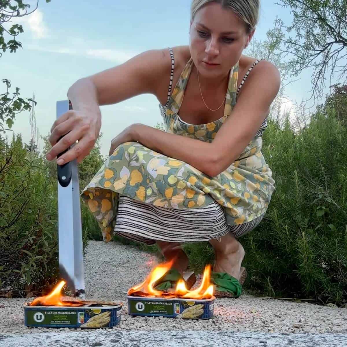 Rosanna cheffing in Provence, making fire roasted tinned mackerel.