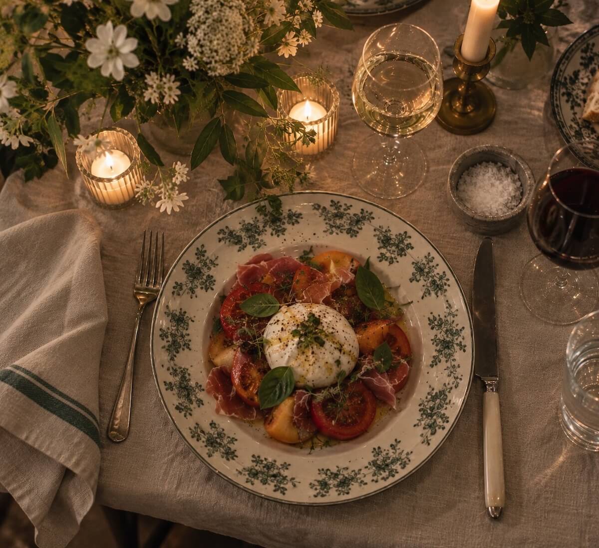 A plate of food at a dinner party.
